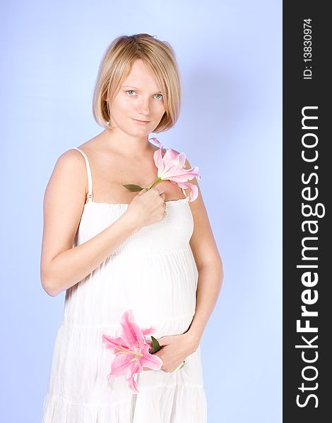 Pregnant female on blue background