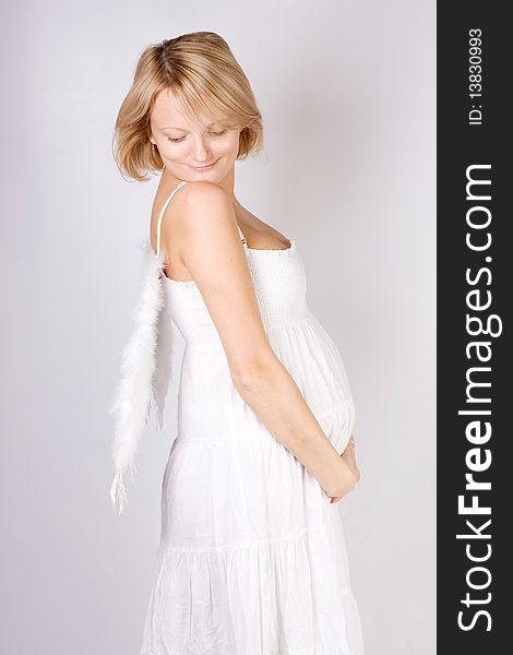 Angel pregnant female on white background