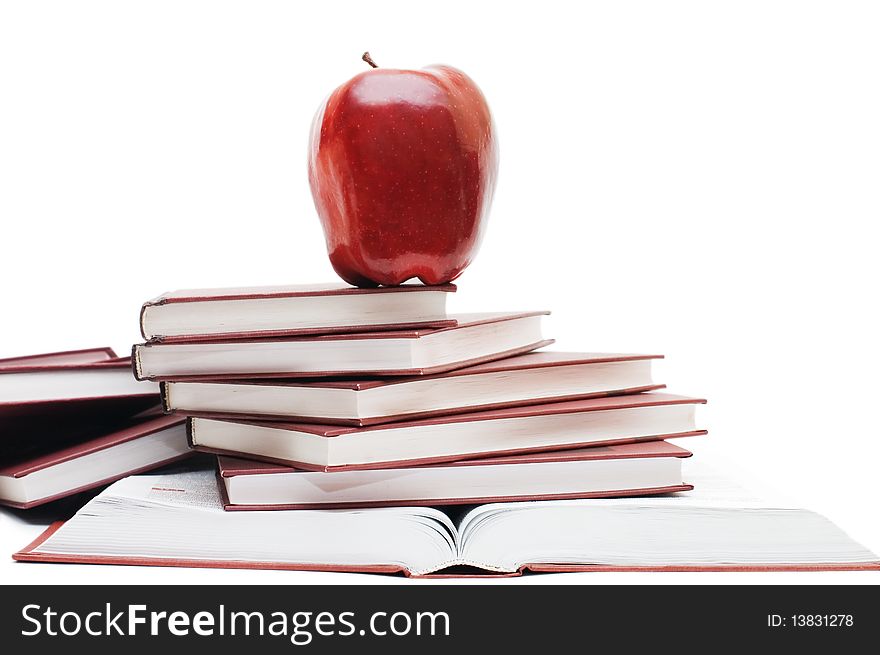 Stack of books and apple isolated