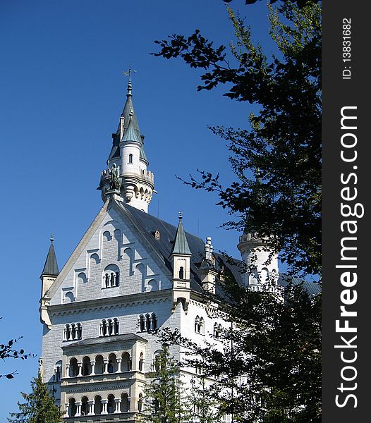 A beautiful small castle Neuschwanstein in Bavaria. Another forest view. A beautiful small castle Neuschwanstein in Bavaria. Another forest view.