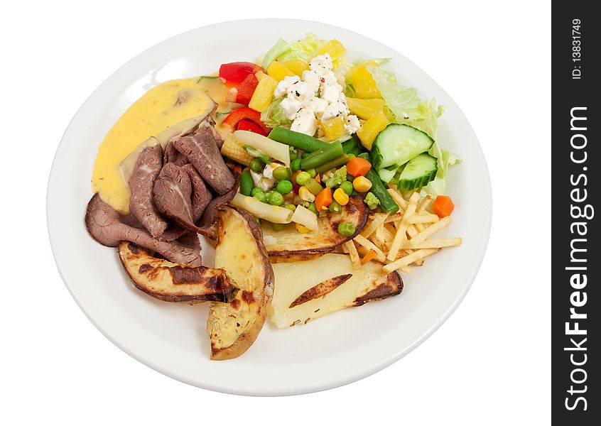 Roast beef with salad, potatoes and bernaise sauce isolated on white. Roast beef with salad, potatoes and bernaise sauce isolated on white.