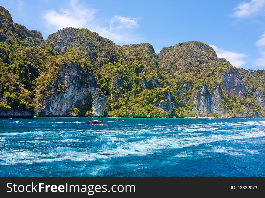 Green cliffs in the sea