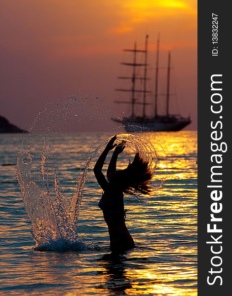 Girl with long hair playing in the sea. Girl with long hair playing in the sea