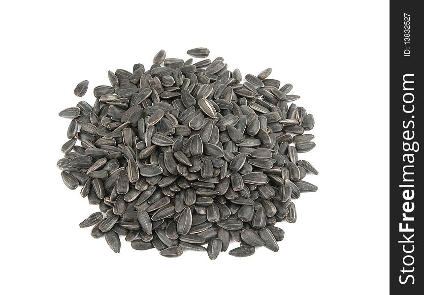 Heap of sunflower seeds isolated on a white