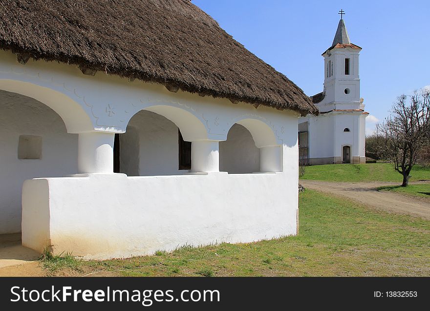 A country house porch and the church.