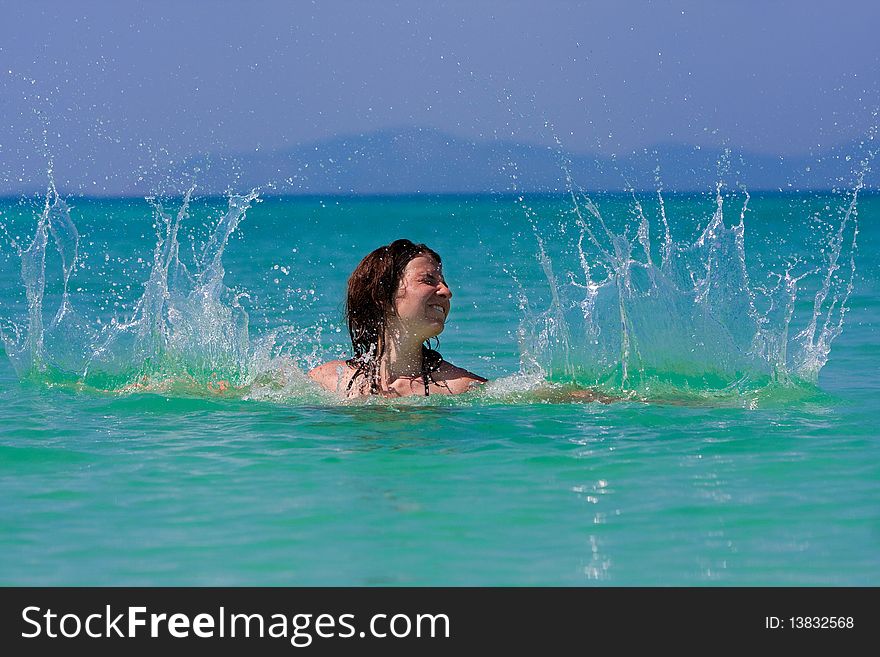 Girl with long hair playing in the sea. Girl with long hair playing in the sea