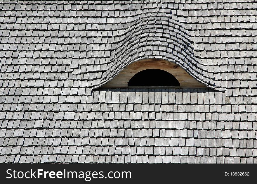 Wood roof and attic window.