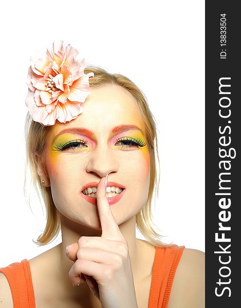 Concept of summer fashion woman with creative eye make-up in yellow and green tones keeping silence. copy-space. Concept of summer fashion woman with creative eye make-up in yellow and green tones keeping silence. copy-space