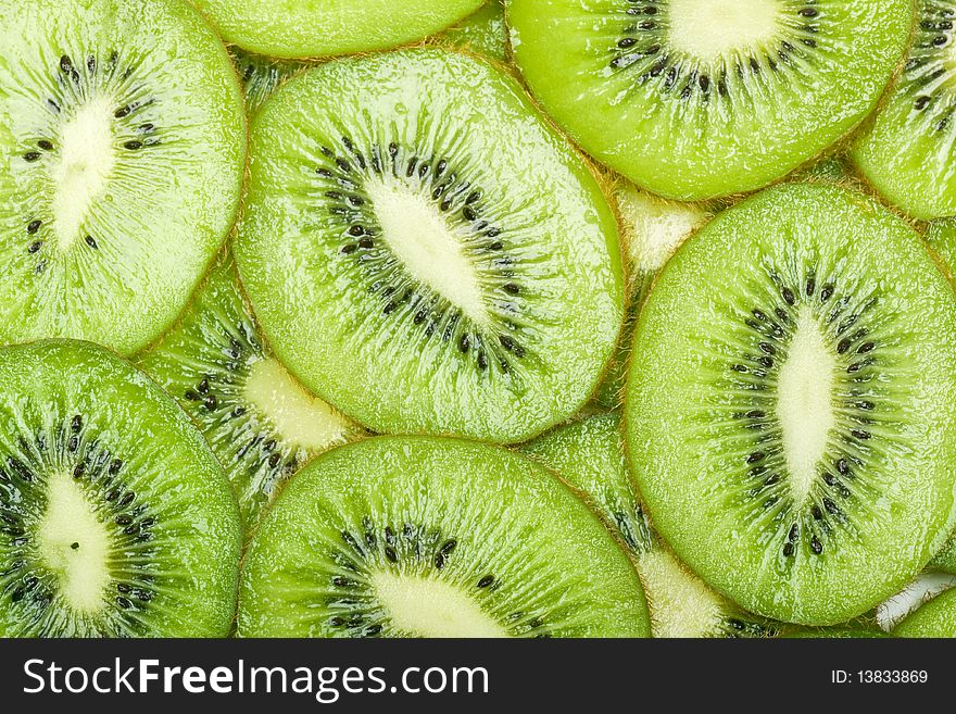 Background with the image of kiwi in a white plate. Background with the image of kiwi in a white plate
