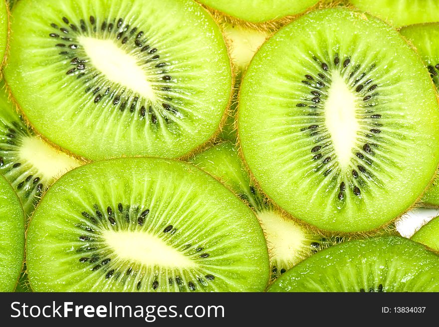 Background with the image of kiwi in a white plate. Background with the image of kiwi in a white plate