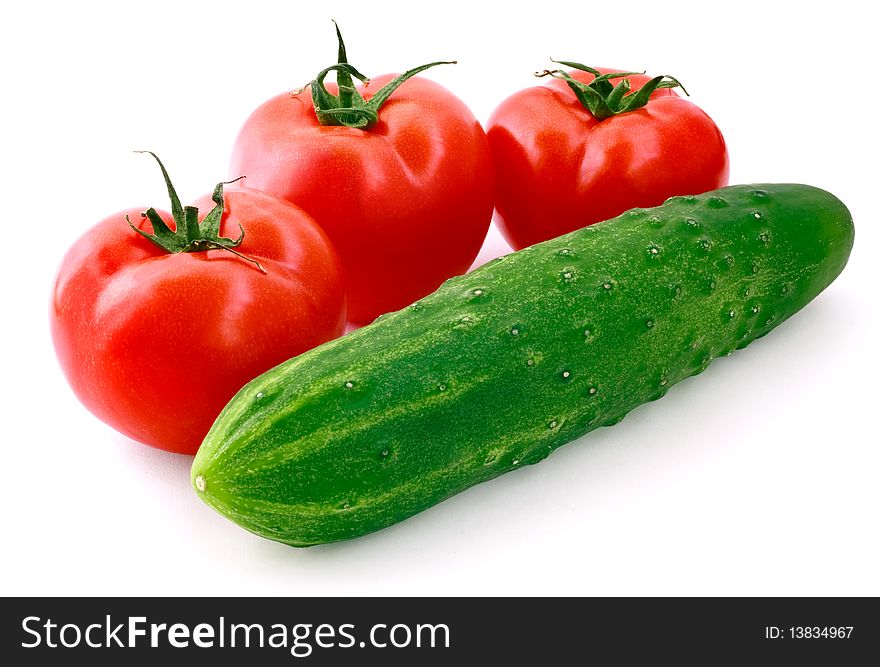 Fresh cucumber and tomatoes on white background. Fresh cucumber and tomatoes on white background