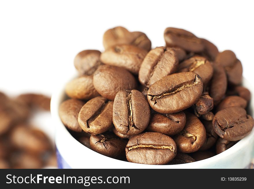 Close up of cup with coffee beans. Close up of cup with coffee beans