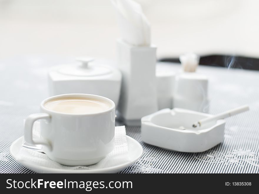 Cafe, coffee table with white crockery