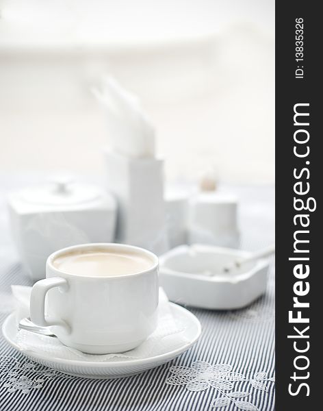 Cafe, coffee table with white crockery