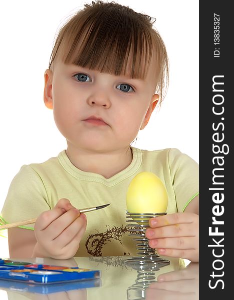 Girl dyes egg by tassel  on white background. Girl dyes egg by tassel  on white background