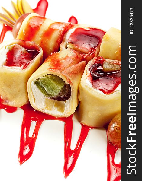 Dessert Maki Sushi - Roll with Various Fruit and Cream Cheese inside. Pancake outside. Served with Pear, Grapes and Berries Sauce. Dessert Maki Sushi - Roll with Various Fruit and Cream Cheese inside. Pancake outside. Served with Pear, Grapes and Berries Sauce