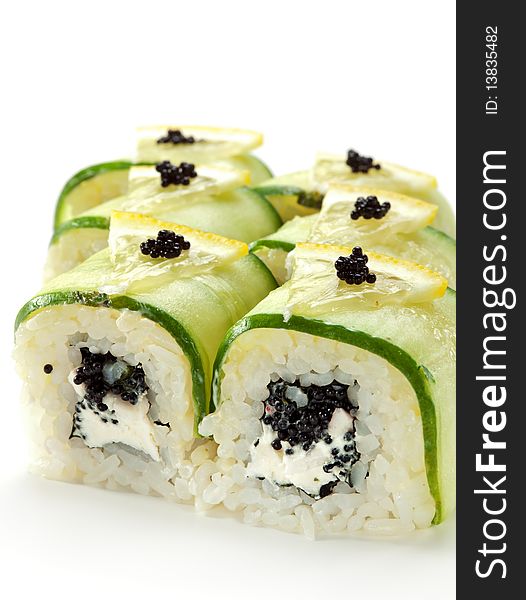 Cucumber Maki Sushi  - Roll made of Imitation Crab, Cream Cheese and Black Tobiko (flying fish roe) inside. Cucumber outside. Topped with Lemon Slice and Tobiko. Cucumber Maki Sushi  - Roll made of Imitation Crab, Cream Cheese and Black Tobiko (flying fish roe) inside. Cucumber outside. Topped with Lemon Slice and Tobiko