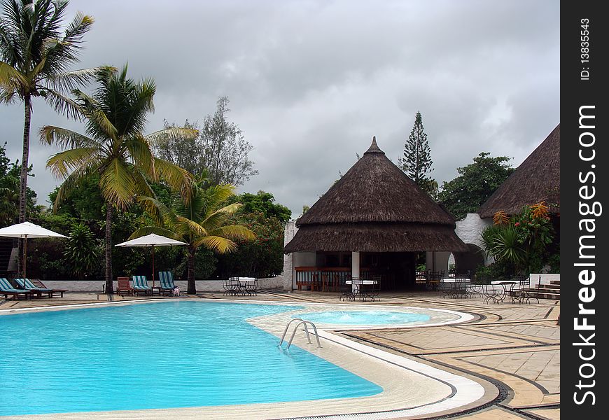 A beautiful swimming pool at a tropical resort. A beautiful swimming pool at a tropical resort.