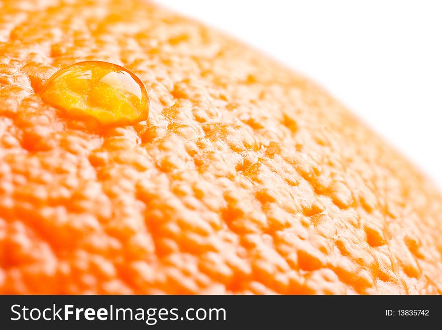 Water drop on the ripe orange, macro closeup photo. Water drop on the ripe orange, macro closeup photo