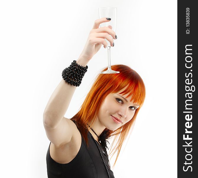 Beautiful red-haired girl lifts a toast