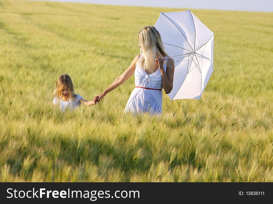Mother And Daughter In Field