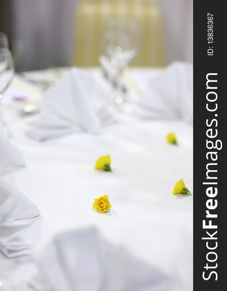 Small yellow flowers decoration on a festive table