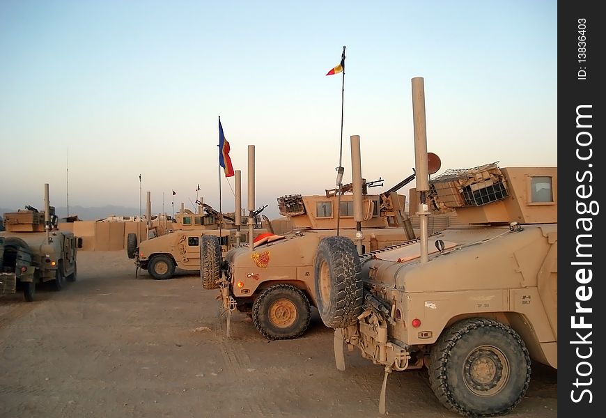 This is a picture with many Humvee trucks parked for the night. This is a picture with many Humvee trucks parked for the night
