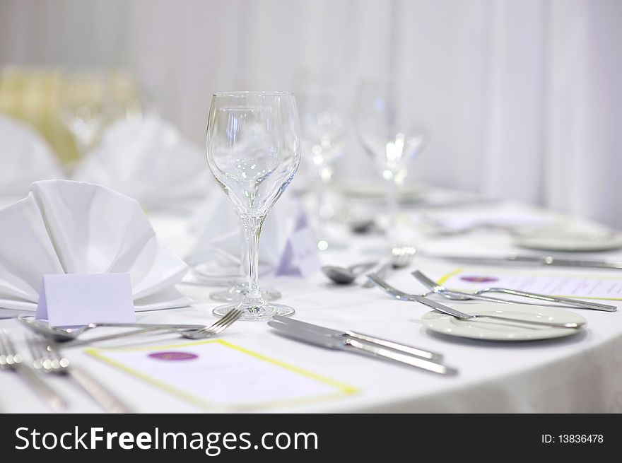 Empty place cards on the white festive table