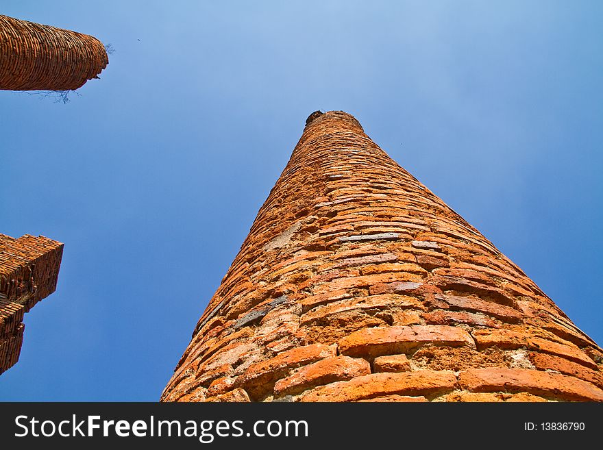 The ancient brick column in a temple,  Ayutthaya, Thailand. The ancient brick column in a temple,  Ayutthaya, Thailand