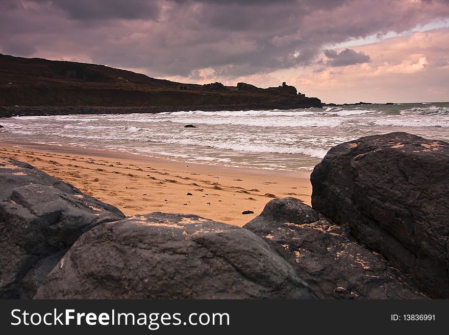 Headland rocks sea and sand. Headland rocks sea and sand