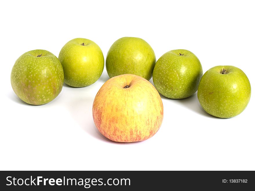 Four tasty green apples piled on a white background