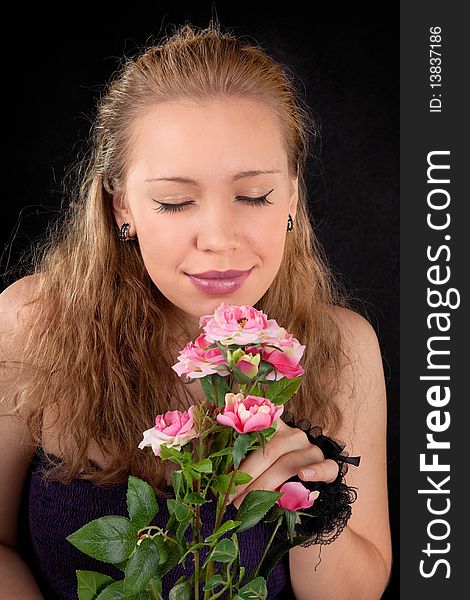 Portrait of a young girl with a flower roses. Portrait of a young girl with a flower roses