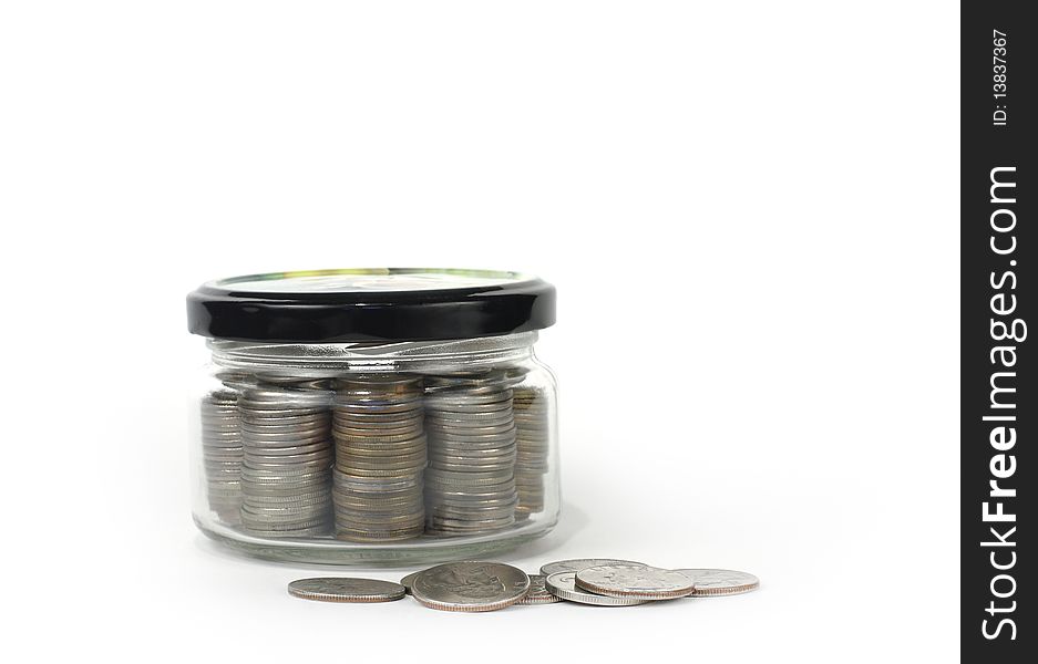 Glass jar with lid closed money on a light background. Glass jar with lid closed money on a light background