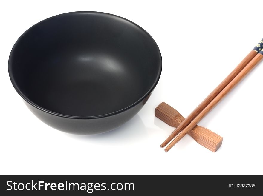 Black bowl and wooden sticks for land. Black bowl and wooden sticks for land