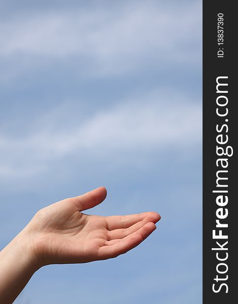 Photo of hand on sky background
