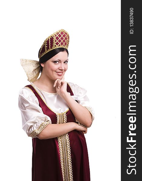 Girl standing in Russian traditional costume. Woman is wearing sarafan and kokoshnik . The girl in red old russian dress. Isolated on white. Girl standing in Russian traditional costume. Woman is wearing sarafan and kokoshnik . The girl in red old russian dress. Isolated on white.