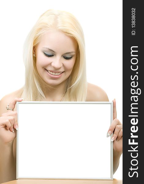 Young blonde smiling woman with blank. Looking down. Isolated on the white