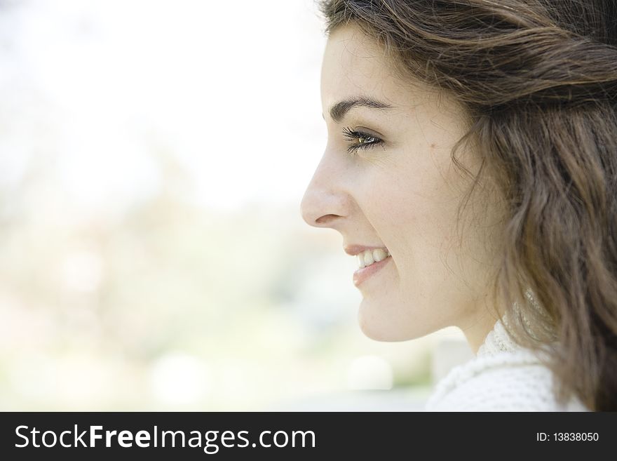 Profile of a Beautiful Young Woman Outdoors. Profile of a Beautiful Young Woman Outdoors