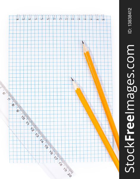 Note pad straightedge and two pencils