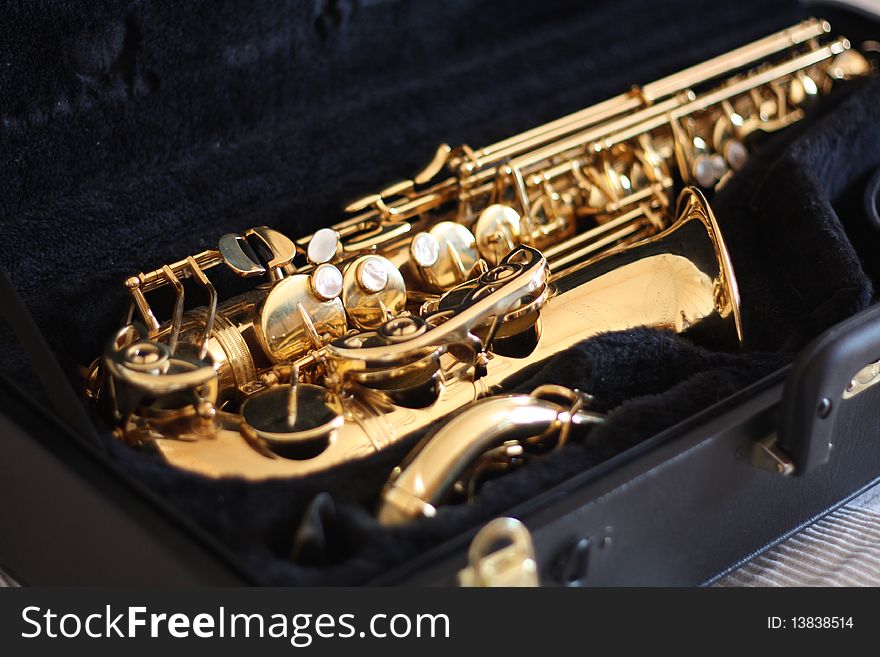 Shiny golden sax in black velvet case