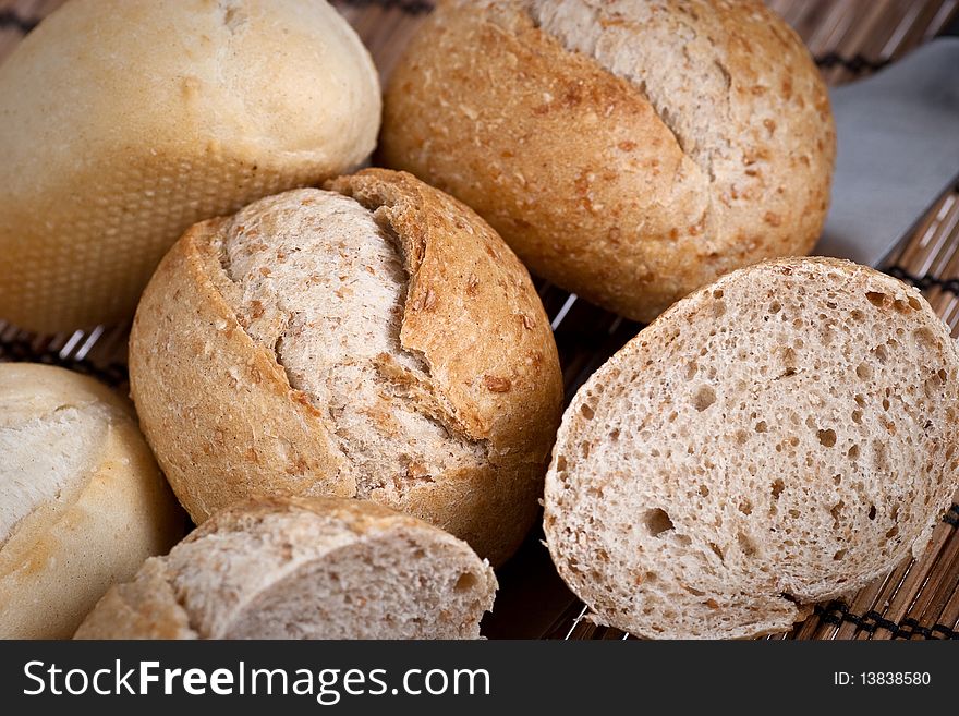 Rye and wheat french bread, baked in a wood oven. Selective focus. Rye and wheat french bread, baked in a wood oven. Selective focus.