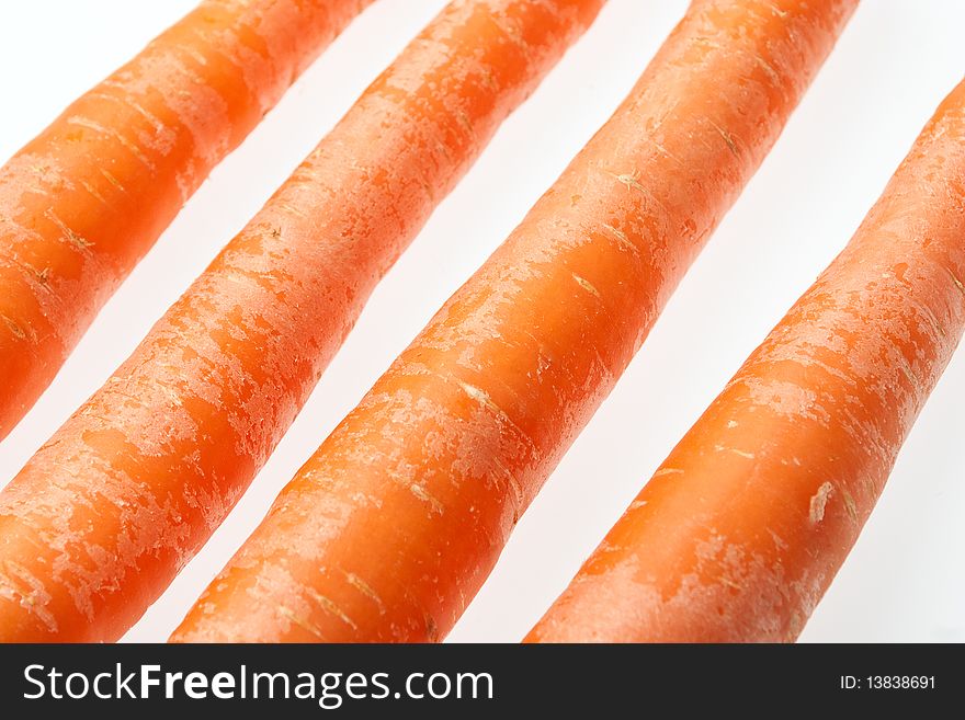 Bunch of fresh carrots isolated on bright white background.