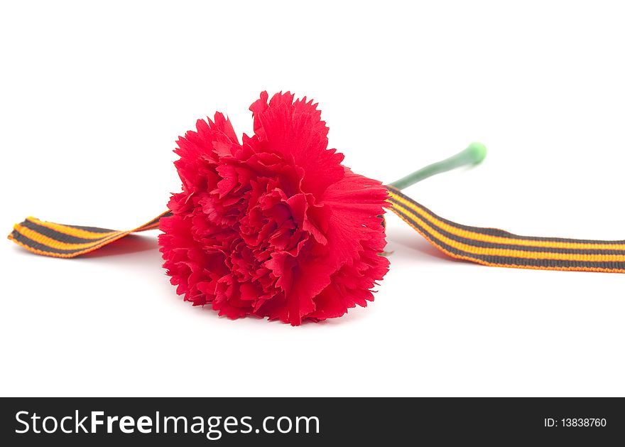 It's the ribbon of Saint George and carnation. Symbols of Russian Victory Day of Second World war.