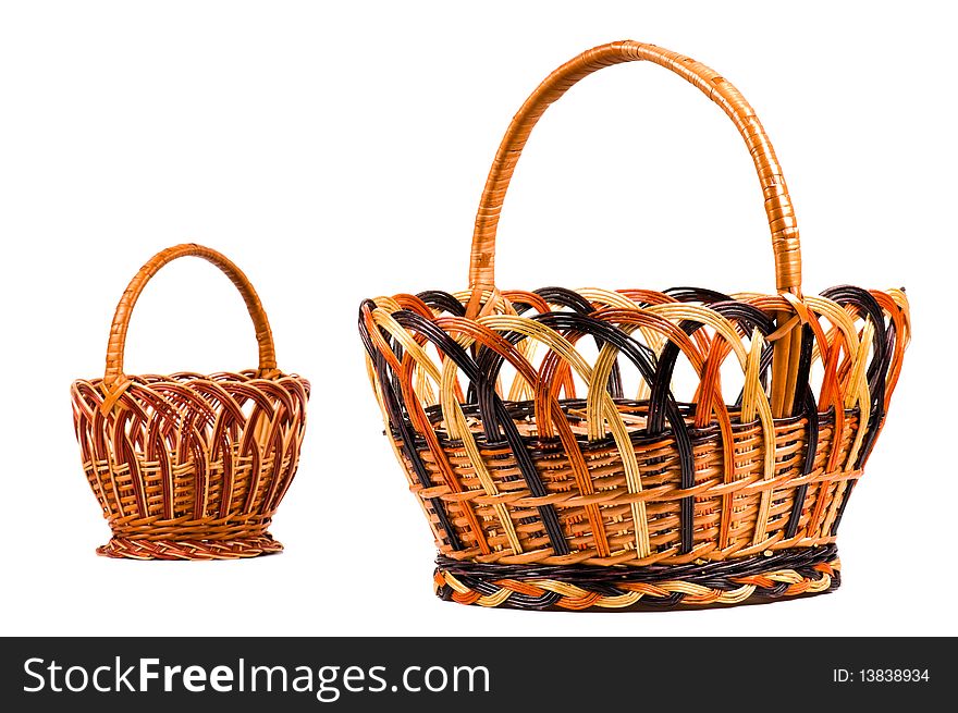 Traditional wicker baskets isolated on white background. Focus on the big basket.