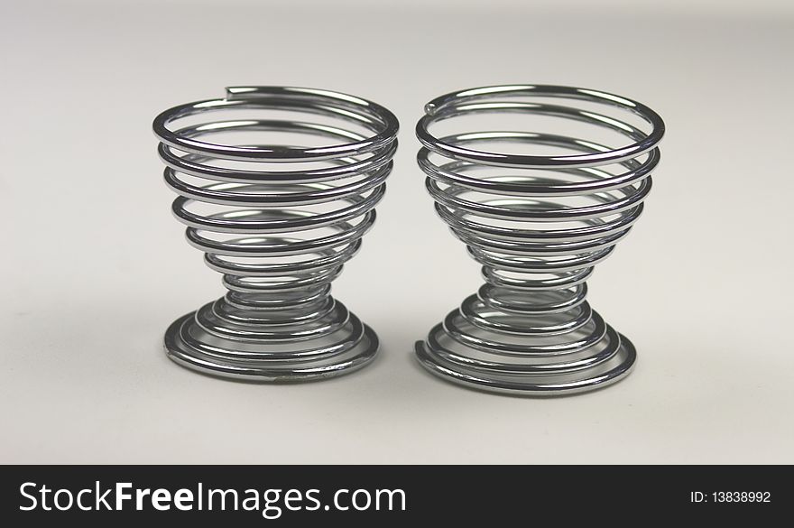 Two spiral metal egg cups empty and waiting for an egg