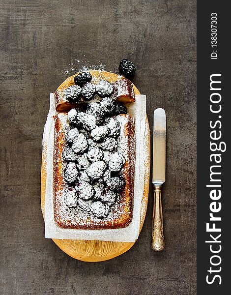 Homemade blackberry cake with icing sugar for holiday flat lay. Homemade blackberry cake with icing sugar for holiday flat lay