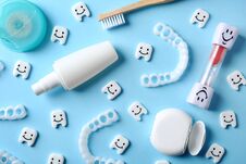 Flat Lay Composition With Small Plastic Teeth And Dental Care Items Royalty Free Stock Image