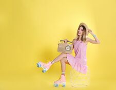Young Woman With Roller Skates And Retro Radio O Royalty Free Stock Images Young Woman With Roller Skates And Retro Radio O Royalty Free Stock Images