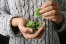 Woman Holding Handful Of Tasty Kiwi, Closeup. Royalty Free Stock Photo