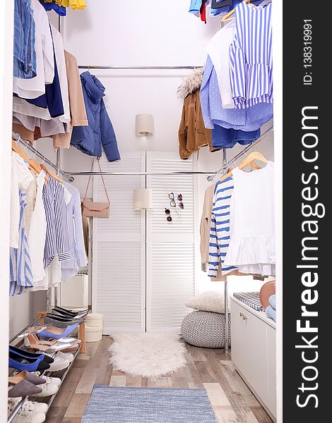 Modern Dressing Room With Different Stylish Clothes